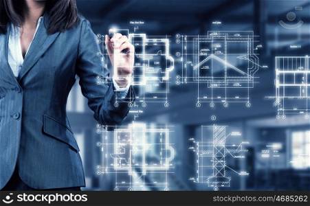Woman using modern technologies for business. Chest view of businesswoman drawing infographs on screen