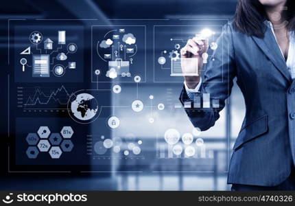 Woman using modern technologies for business. Chest view of businesswoman drawing infographs on screen