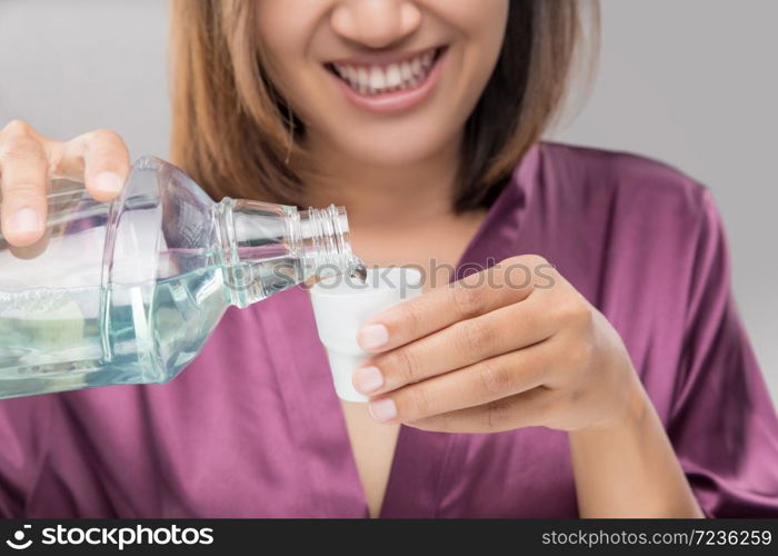 Woman Using Mouthwash After Brushing, Portrait Hands Pouring Mouthwash Into Bottle Cap, Dental Health Concepts