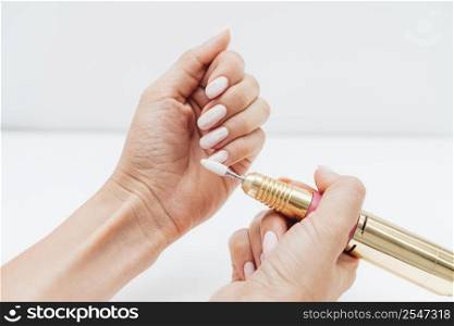 woman using nail file high view