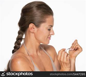 Woman using nail polish