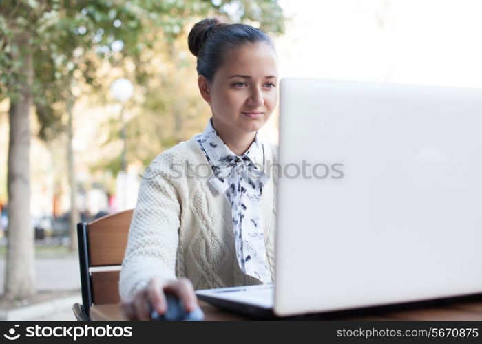 woman using notebook during work outdoor