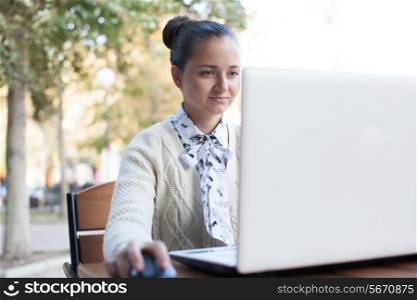 woman using notebook during work outdoor
