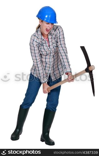 Woman using pick-ax
