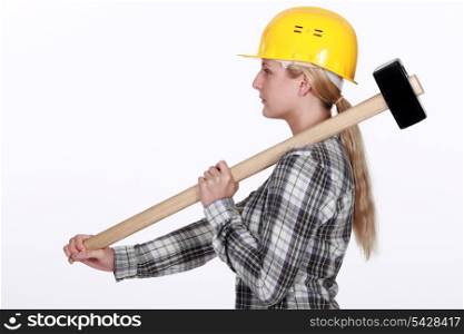 Woman using sledge-hammer