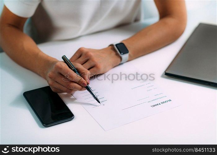 Woman Using Smart Phone Application for Blood Panel List . Woman Using Smart Phone Application for Blood Panel List