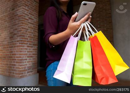Woman using smartphone for shopping online, shopping concept.