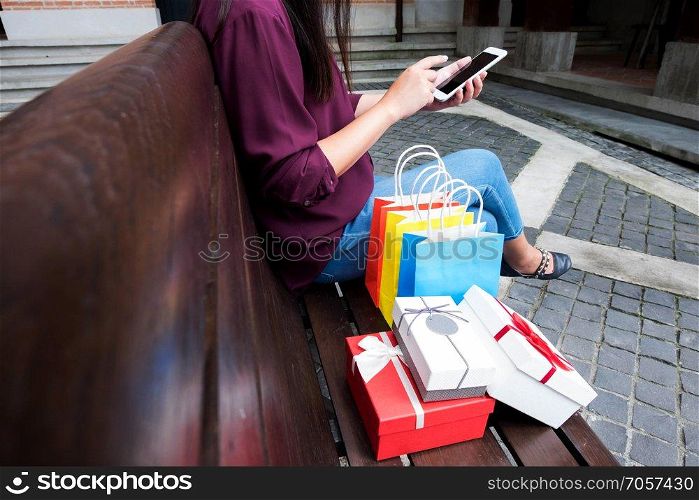 Woman using smartphone for shopping online, shopping concept.