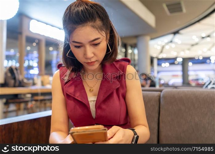 woman using smartphone in the cafe