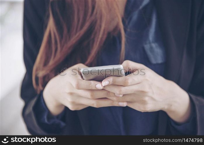 Woman using smartphone shopping online and call with technology lifestyle. Smiling face of asian woman holding cellphone with E-commerce Shopping online website Reading Online Article, Blog and vlog.