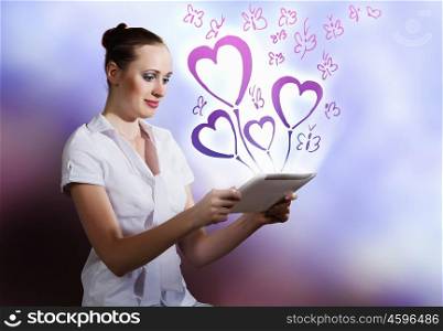 Woman using tablet pc. Young woman using holding tablet pc. Romance concept