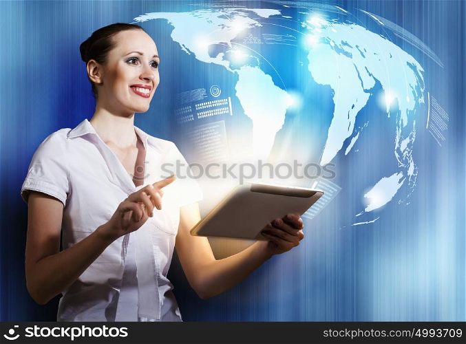 Woman using tablet pc. Young woman using tablet pc and media background