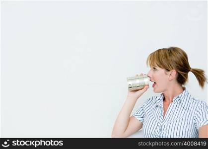Woman using tin can telephone