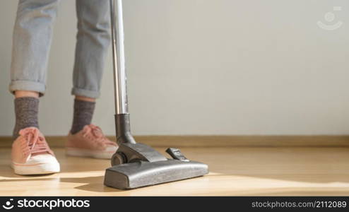 woman using vacuum cleaner