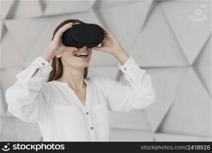 woman using virtual reality headset side view