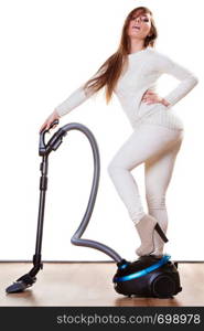 Woman vacuuming the house. Funny girl with vacuum cleaner. Housework