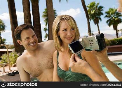 Woman Video Taping Couple