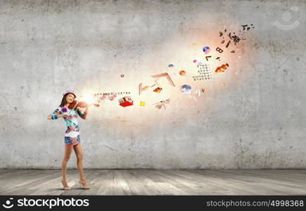 Woman violinist. Young attractive woman in colored dress playing violin