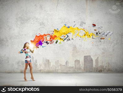 Woman violinist. Young attractive woman in colored dress playing violin