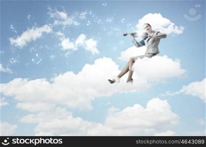 Woman violinist. Young businesswoman sitting on cloud and playing violin