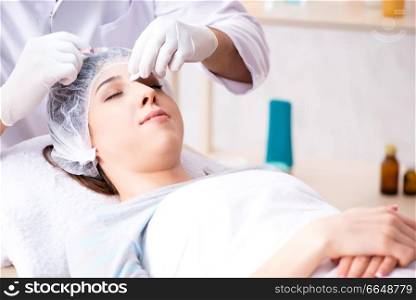Woman visiting doctor for plastic surgery