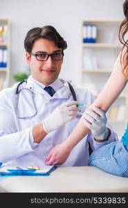 Woman visiting doctor in medical concept