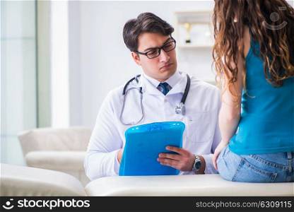 Woman visiting doctor in medical concept