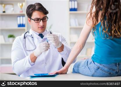Woman visiting doctor in medical concept