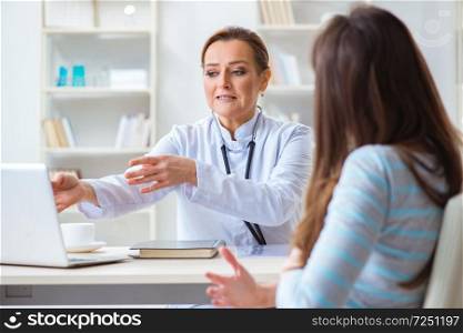 Woman visiting female doctor for regular check-up 