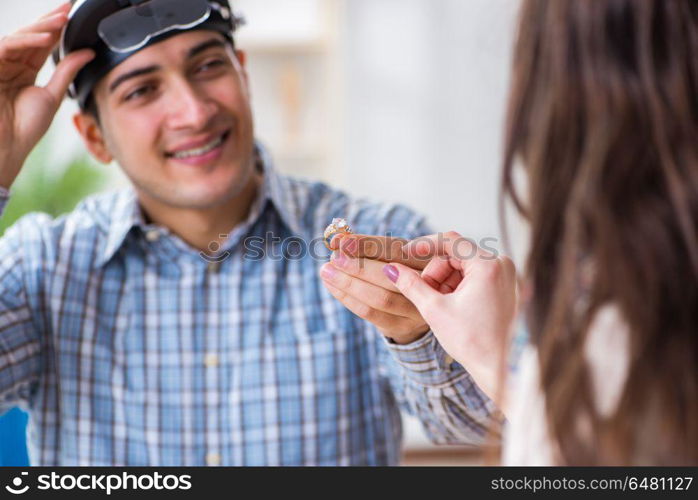 Woman visiting jeweler for jewelery evaluation