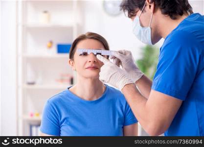 Woman visiting male doctor for plastic surgery
