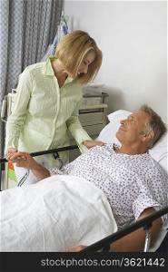 Woman visiting man in hospital