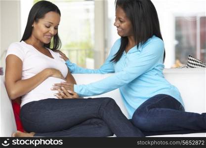 Woman Visiting Pregnant Friend At Home