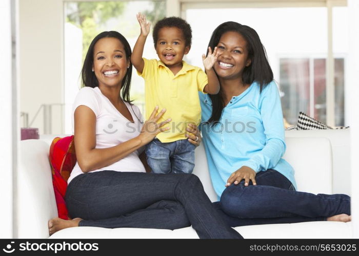 Woman Visiting Pregnant Friend With Son At Home