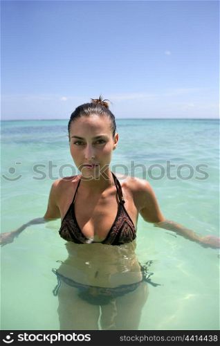 Woman wading in the sea
