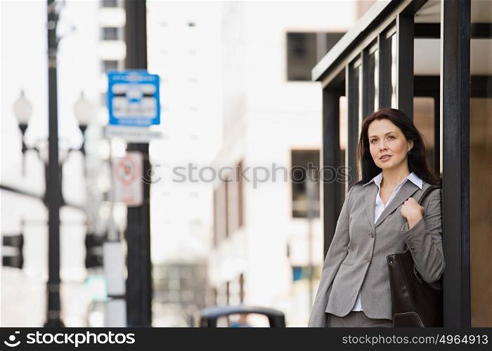 Woman waiting at bus stop