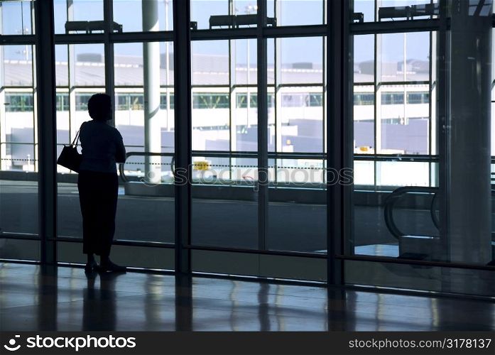 Woman waiting at the international airport terminal