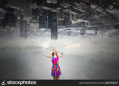 Woman waiting surprise. Young woman in multicolored dress covering eyes with hands