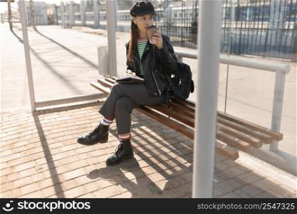 woman waiting tramway station