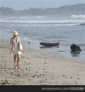 Woman walking along the Seashore in Costa Rica