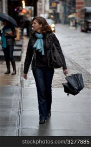 Woman walking in Manhattan, New York City, U.S.A.