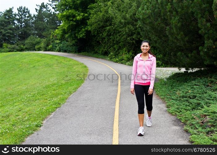 Woman walking on the jogging path