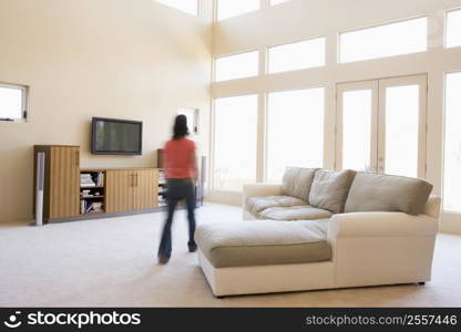 Woman walking through living room