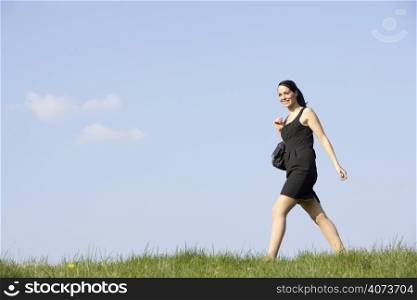 Woman Walking Through Summer Countryside