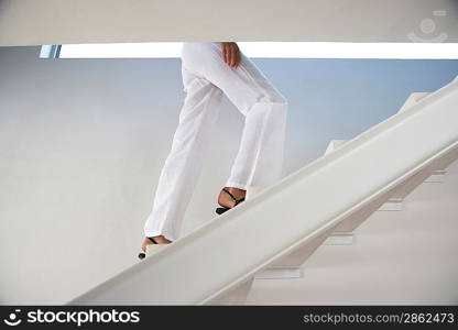 Woman Walking up Steps