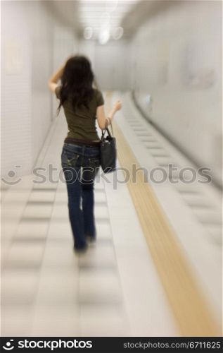 Woman walking with a bag