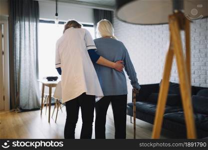 woman walking with nurse old age home. Resolution and high quality beautiful photo. woman walking with nurse old age home. High quality and resolution beautiful photo concept