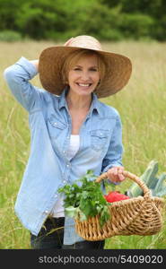 Woman walking with vegetable basket