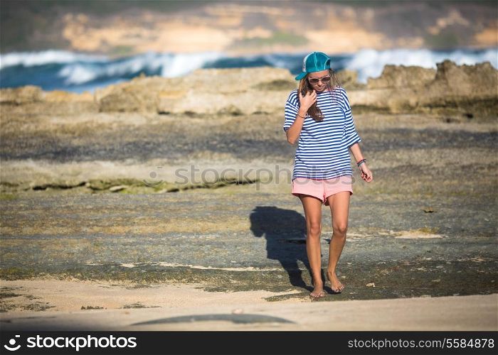 Woman Walks Alone on a Deserted Beach. Lombok Island. Indonesia.