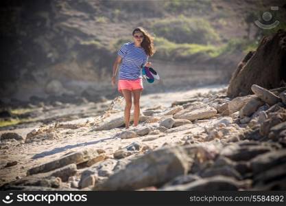 Woman Walks Alone on a Deserted Beach. Lombok Island. Indonesia.